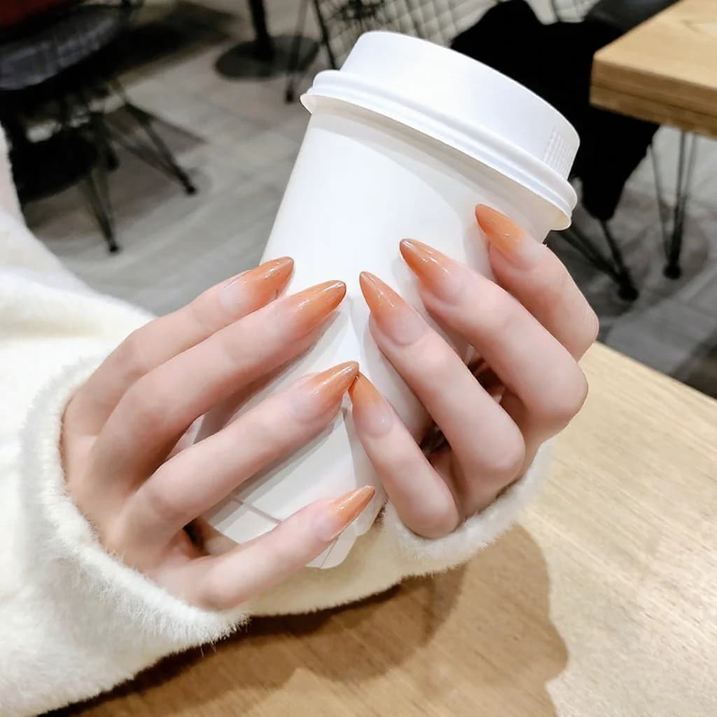Lange press-on nails met kleurverloop en sterrenpatroon