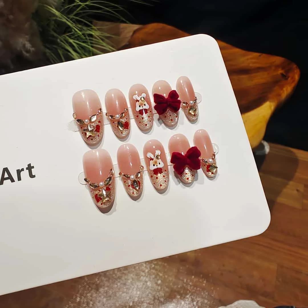 Press-on nails katenoog french tip met strass en strik