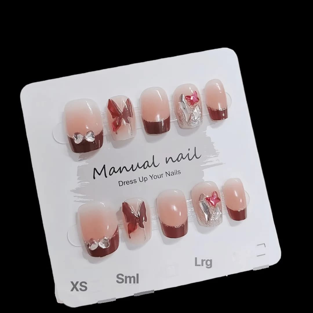 Rode French tip kunstnagels met vlinder- en glitterdetails